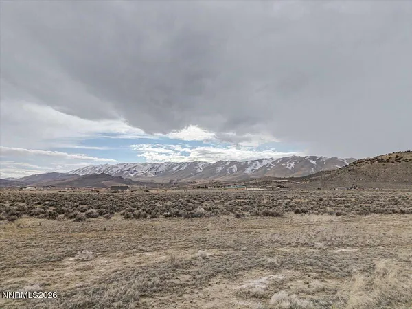 a view of an ocean with a mountain