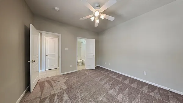 a view of a livingroom with a chandelier fan
