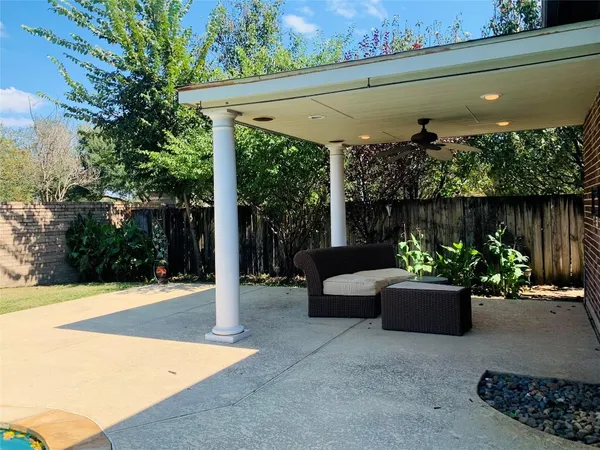 a view of brick house with a large window