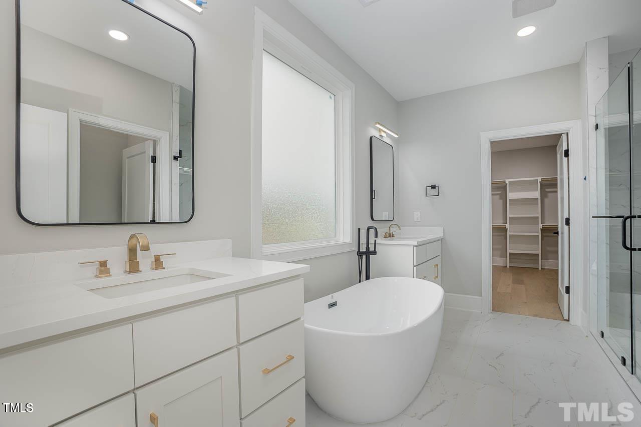 9 High Ridge Lane Pittsboro, NC 27312 - Photo 17 of 25 a bathroom with a bathtub shower sink and mirror