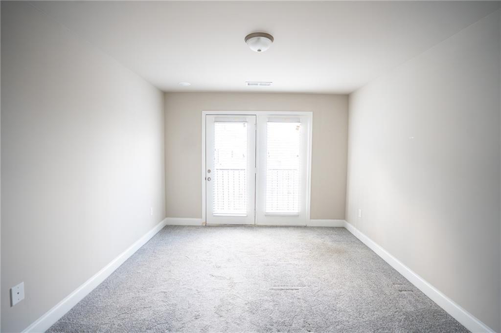 2215 Manor Pointe Drive Cumming, GA 30041 - Photo 24 of 25 a view of an empty room with a window