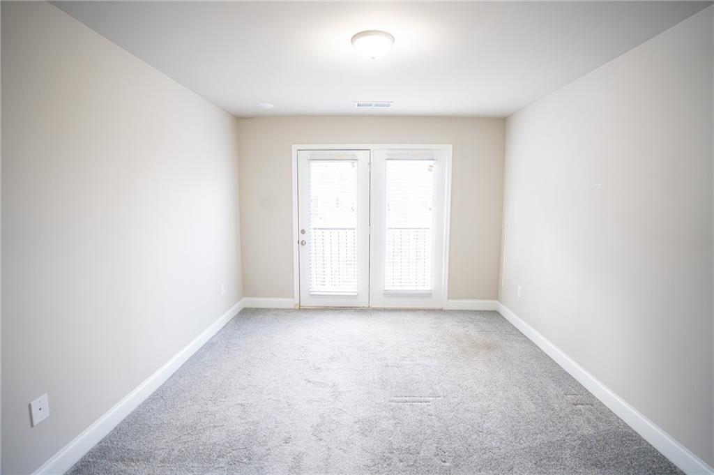 2215 Manor Pointe Drive Cumming, GA 30041 - Photo 25 of 25 an empty room with a window