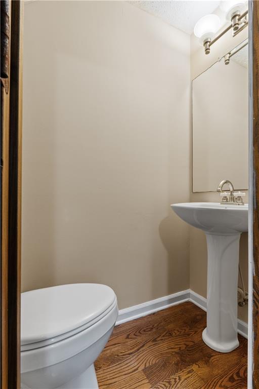112 Brannon Road Buchanan, GA 30113 - Photo 16 of 40 a bathroom with a toilet a sink and mirror