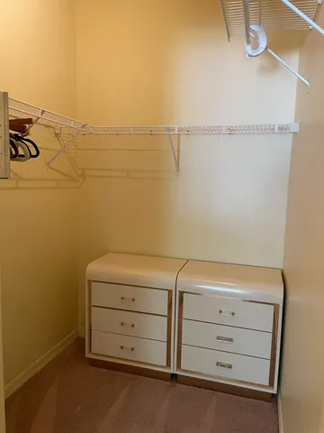 a bathroom with a sink and mirror with toilet