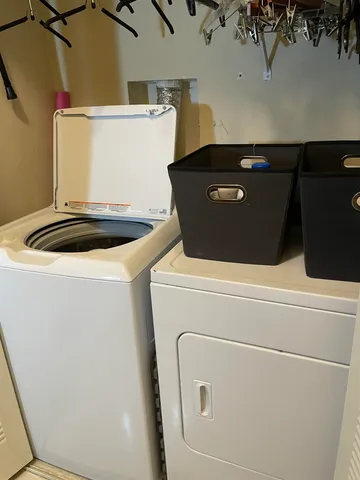 an empty room with a ceiling fan and a window