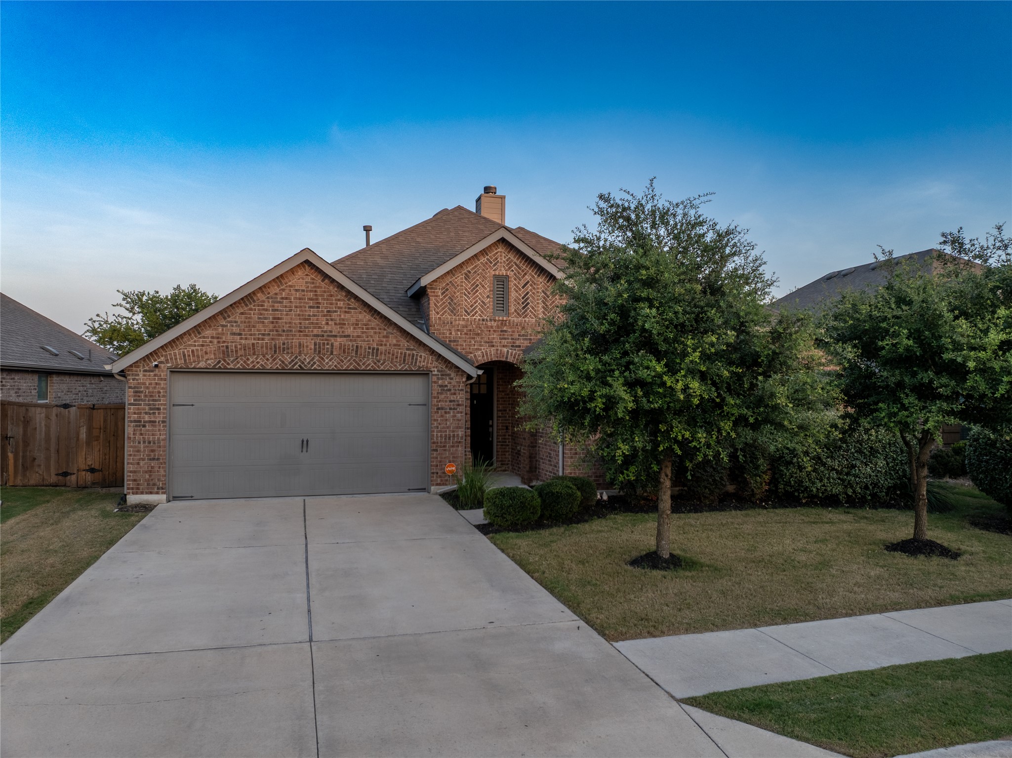 188 Nautical Loop Kyle, TX 78640 - Photo 35 of 38 A well-maintained brick exterior with an attached garage offers appealing curb appeal.