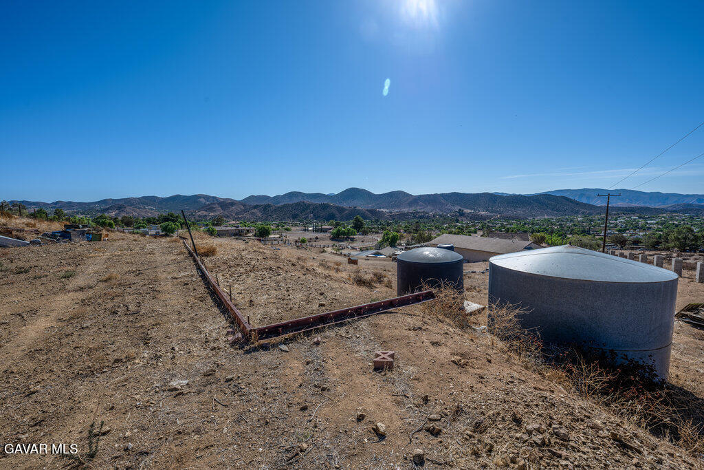 9555 Hierba Road Agua Dulce, CA 91390 - Photo 12 of 19 a view of a terrace with a table and chairs