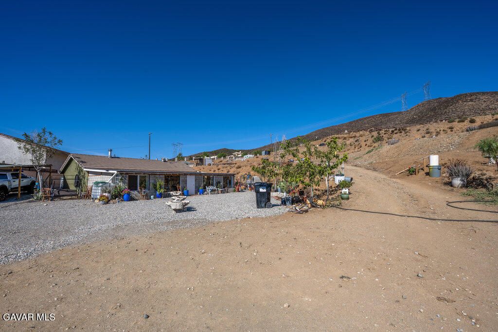 9555 Hierba Road Agua Dulce, CA 91390 - Photo 15 of 19 a view of a road with a building in the background
