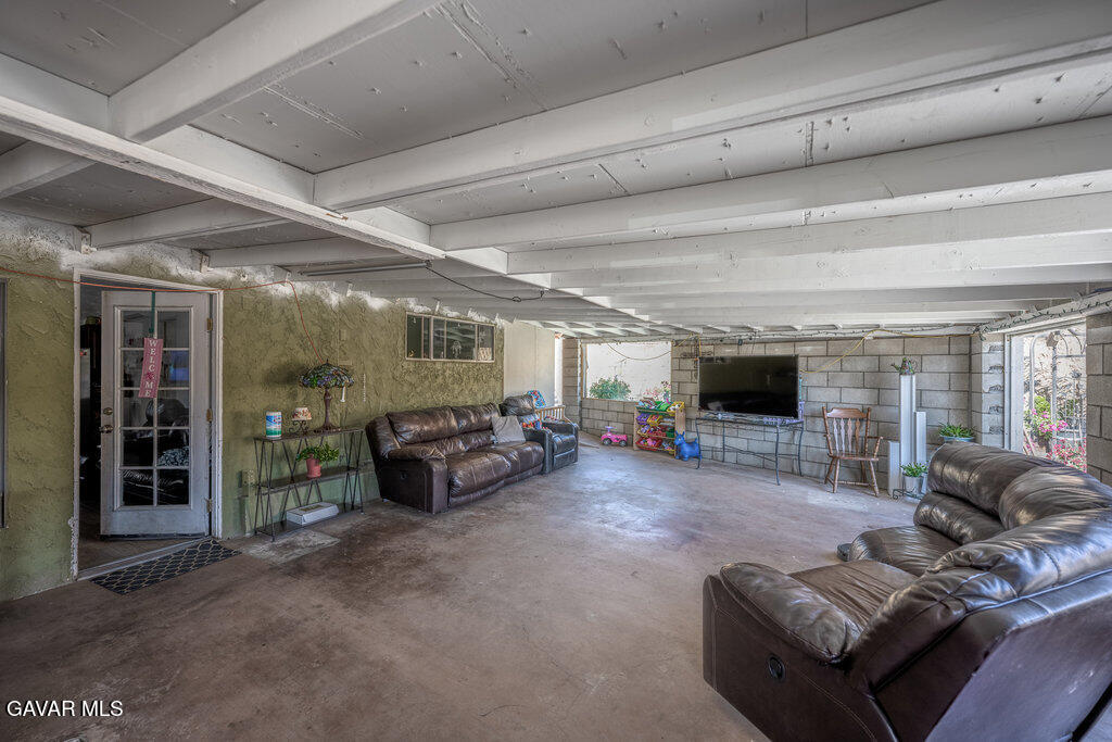 9555 Hierba Road Agua Dulce, CA 91390 - Photo 18 of 19 a living room with furniture and a flat screen tv