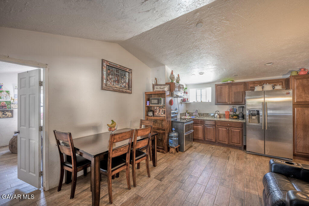 9555 Hierba Road Agua Dulce, CA 91390 - Photo 19 of 19 a kitchen with cabinets and wooden floor