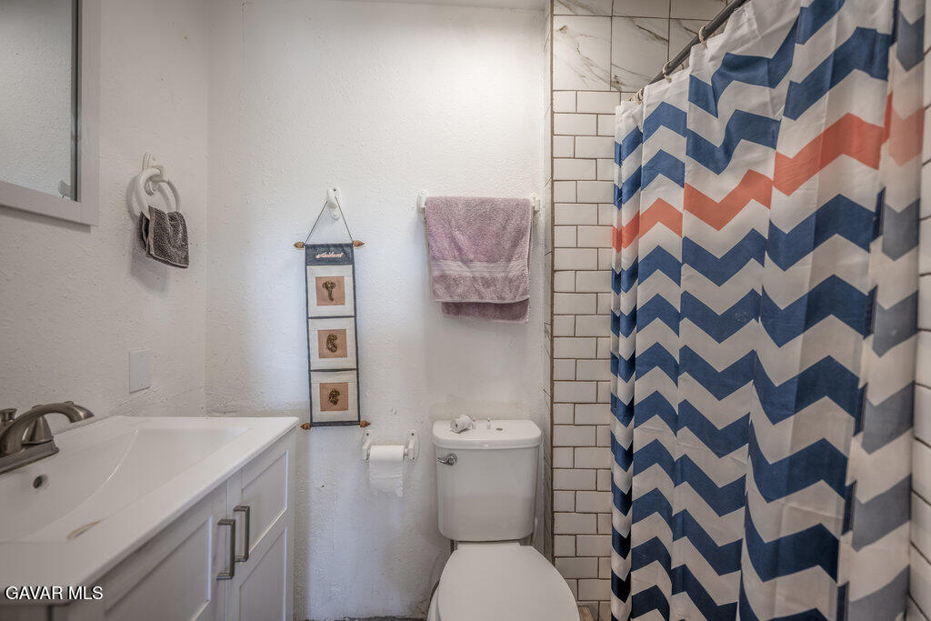 9555 Hierba Road Agua Dulce, CA 91390 - Photo 9 of 19 a bathroom with a sink toilet and shower
