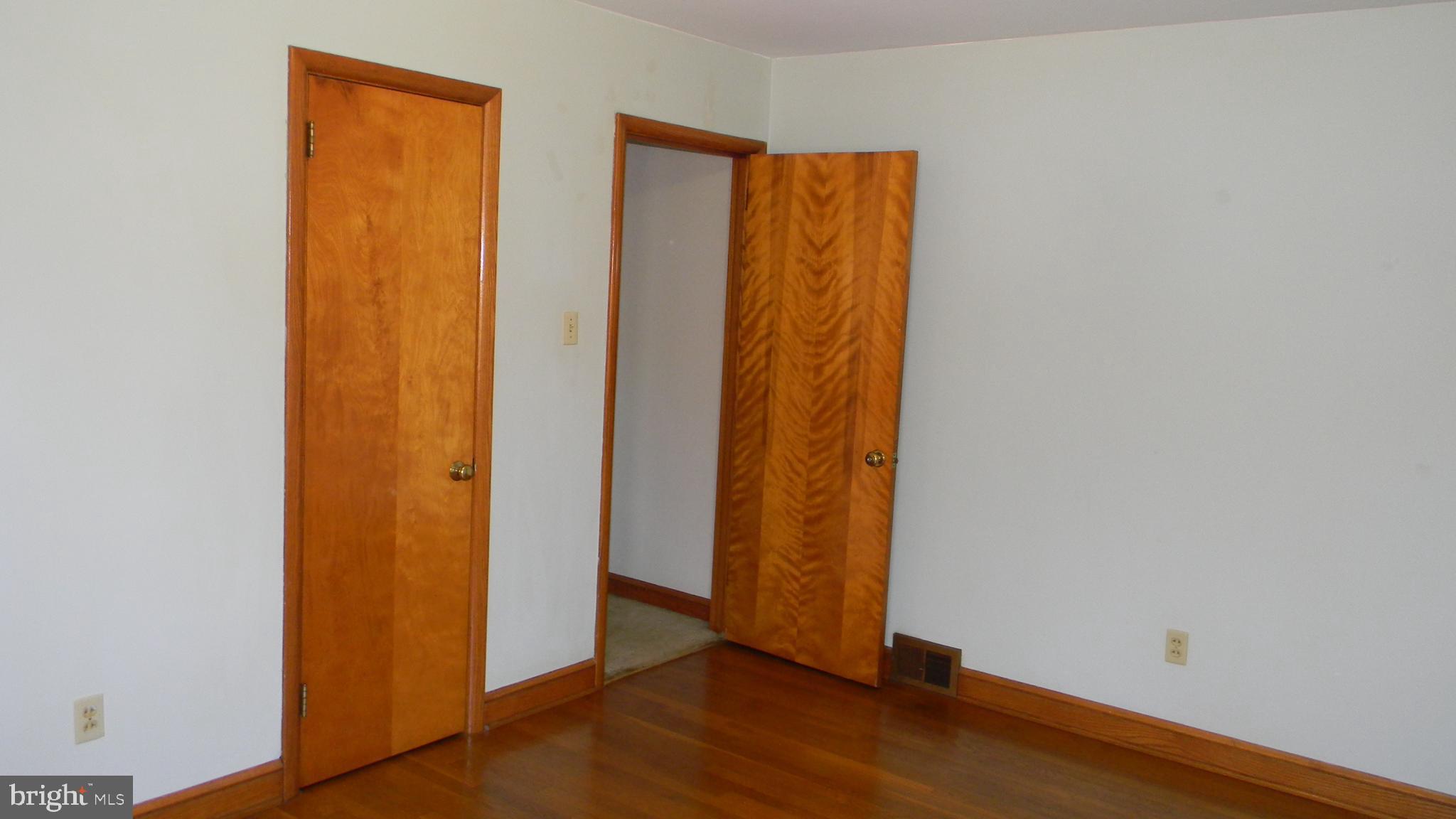 6688 Brocks Gap Road Broadway, VA 22815 - Photo 51 of 81 an empty room with wooden floor and closet