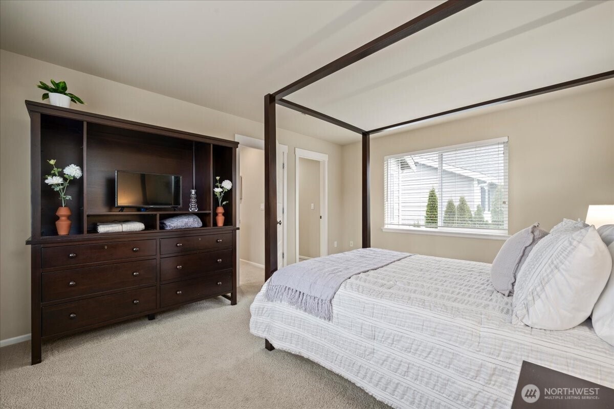 18213 36th Avenue Southeast Bothell, WA 98012 - Photo 17 of 34 a bedroom with a bed and a dresser