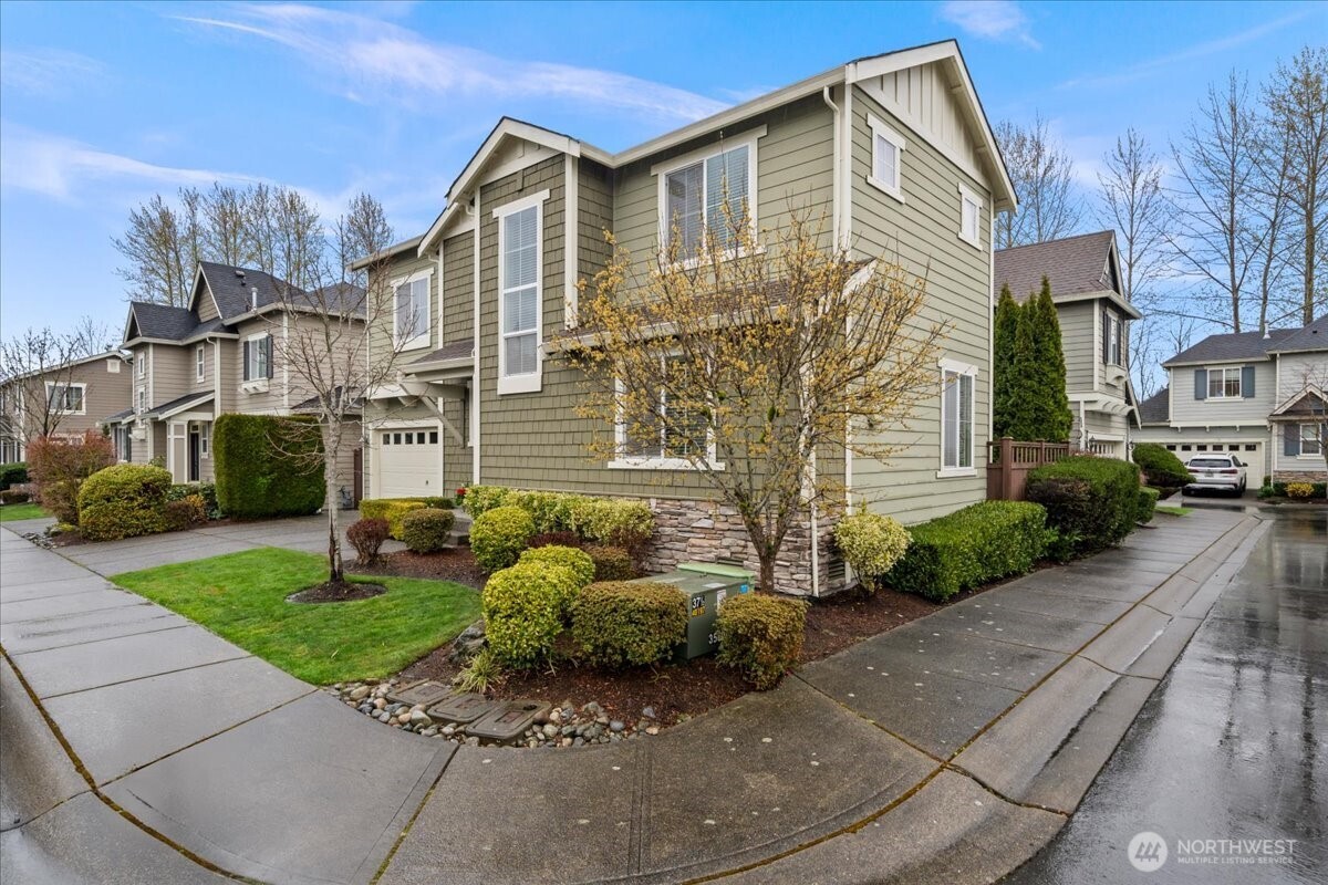18213 36th Avenue Southeast Bothell, WA 98012 - Photo 2 of 34 a front view of a house with garden