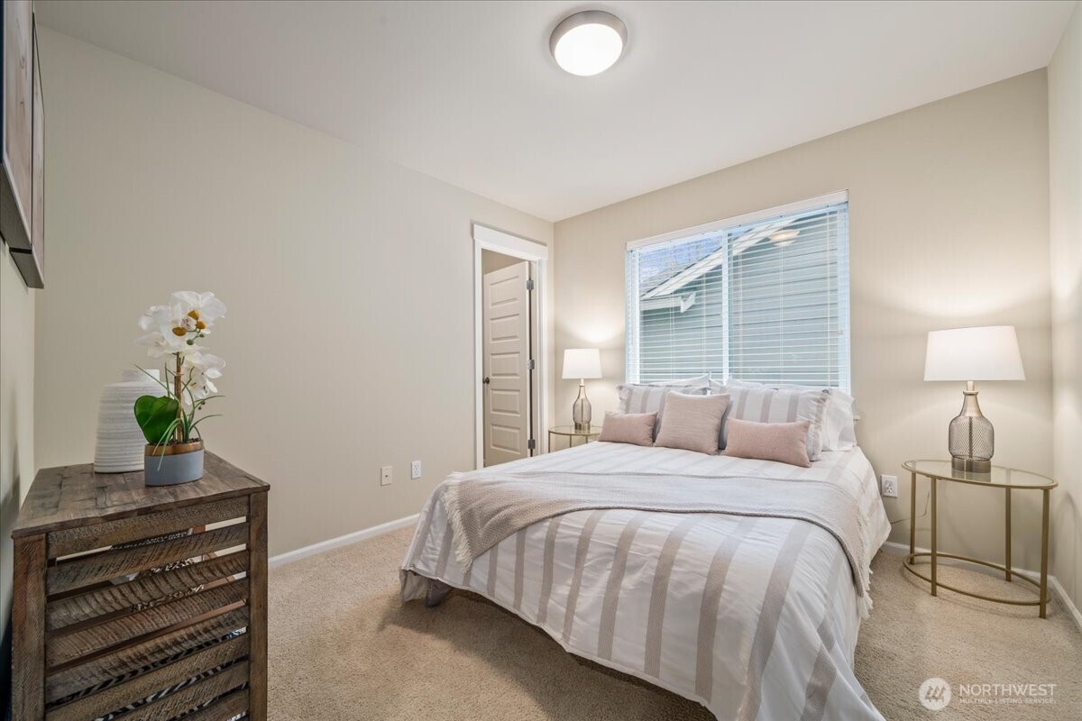 18213 36th Avenue Southeast Bothell, WA 98012 - Photo 23 of 34 a bedroom with a bed and a potted plant