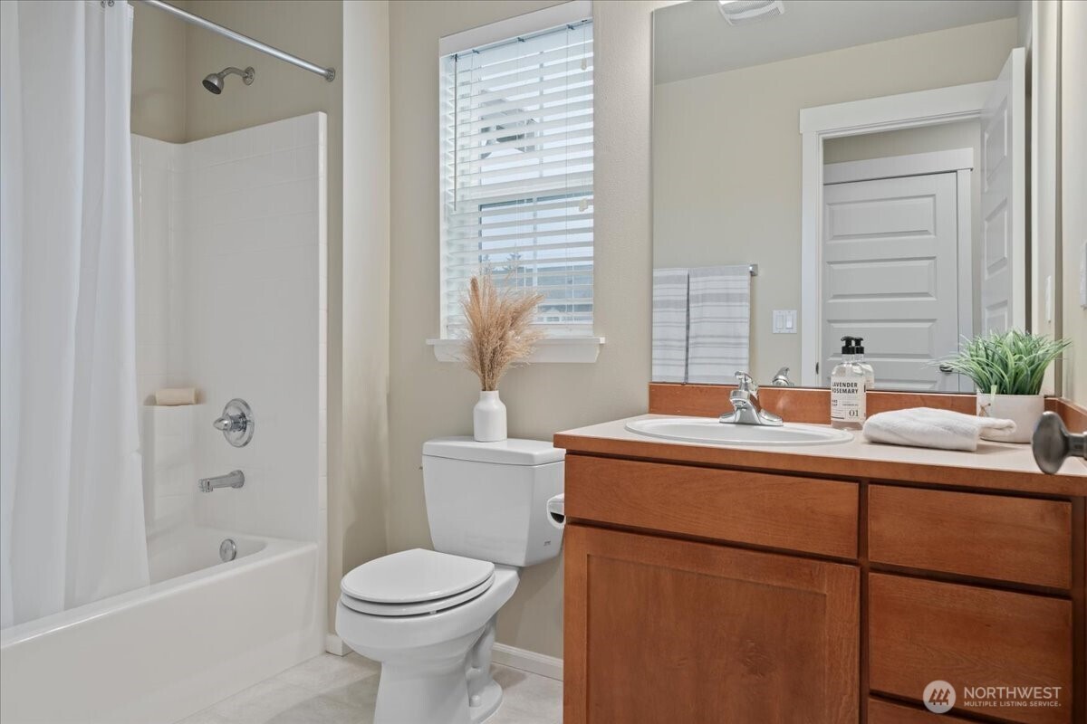 18213 36th Avenue Southeast Bothell, WA 98012 - Photo 25 of 34 a bathroom with a sink toilet and shower