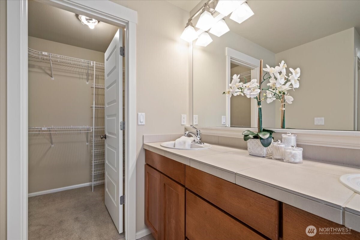18213 36th Avenue Southeast Bothell, WA 98012 - Photo 26 of 34 a bathroom with a sink a light fixture and a mirror