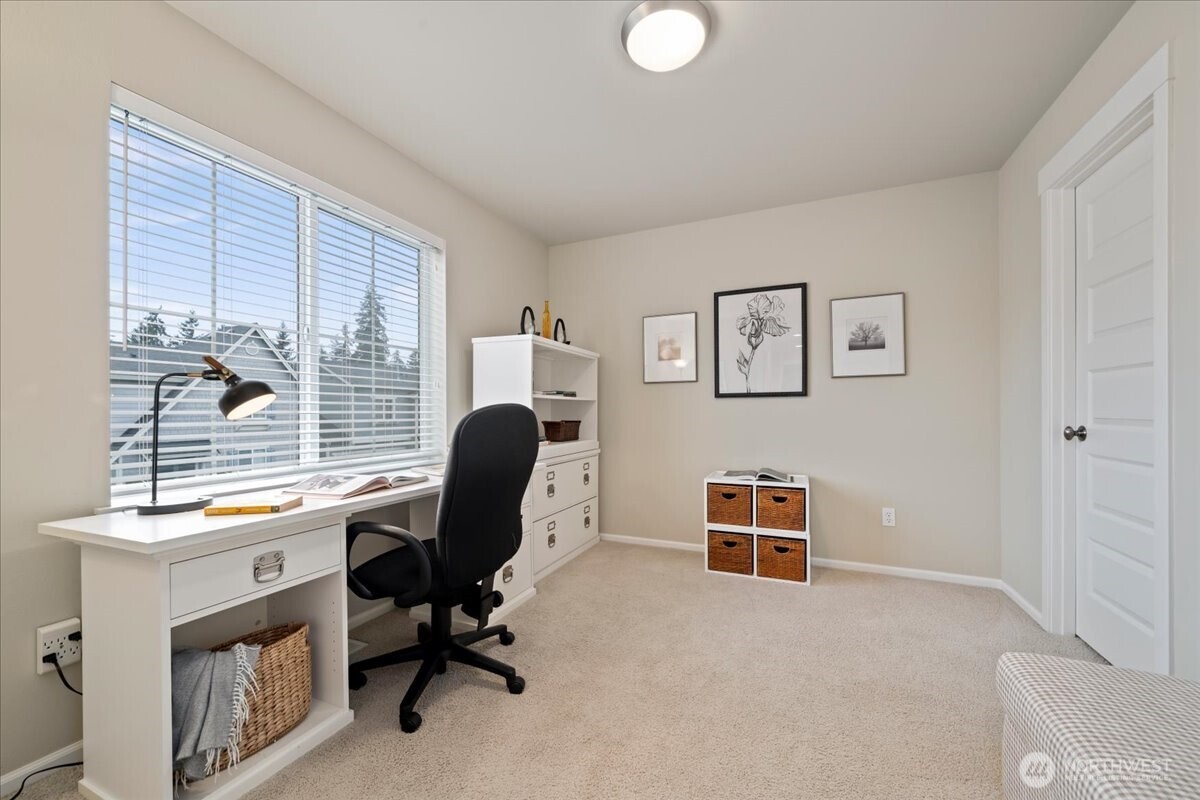 18213 36th Avenue Southeast Bothell, WA 98012 - Photo 27 of 34 a view of a workspace with furniture and a window