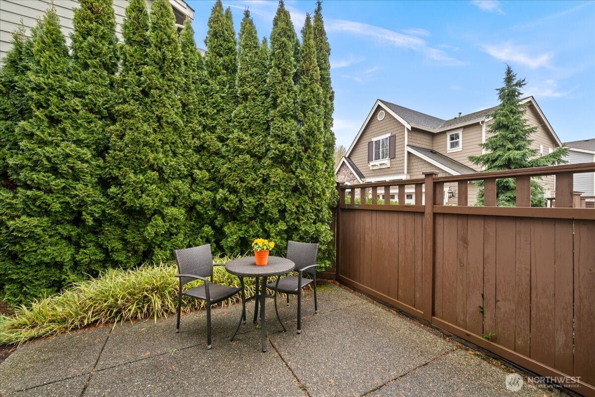 18213 36th Avenue Southeast Bothell, WA 98012 - Photo 30 of 34 a view of a chairs and table in a backyard