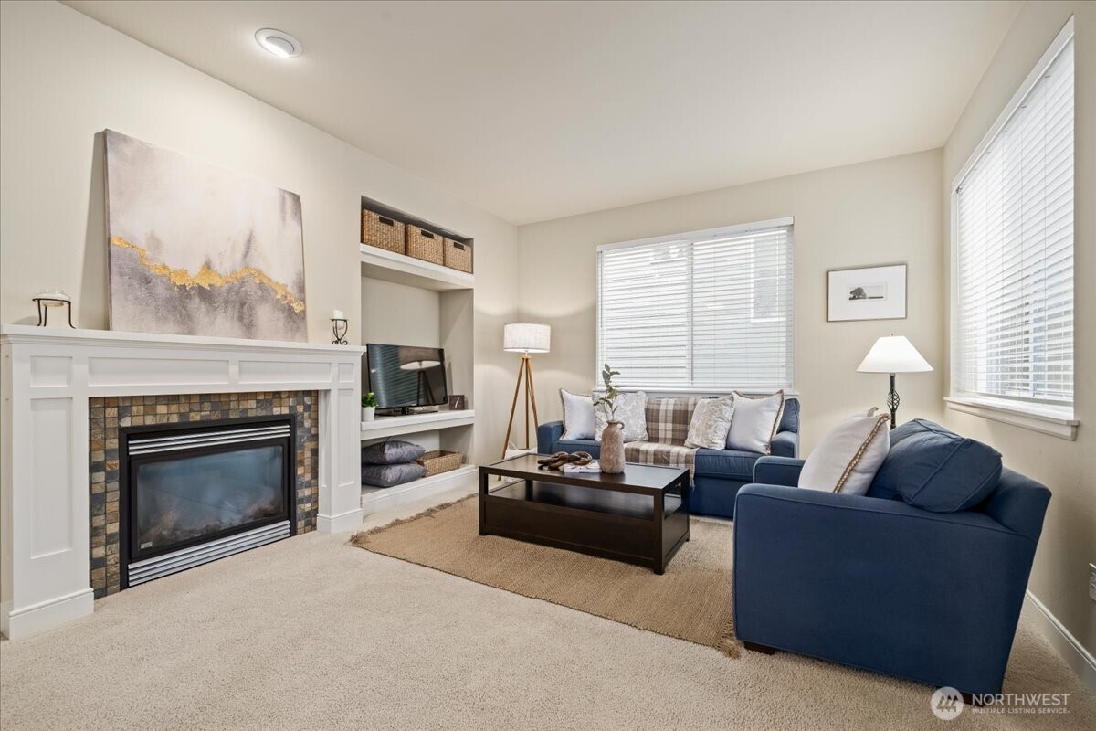 18213 36th Avenue Southeast Bothell, WA 98012 - Photo 3 of 34 a living room with furniture and a fireplace