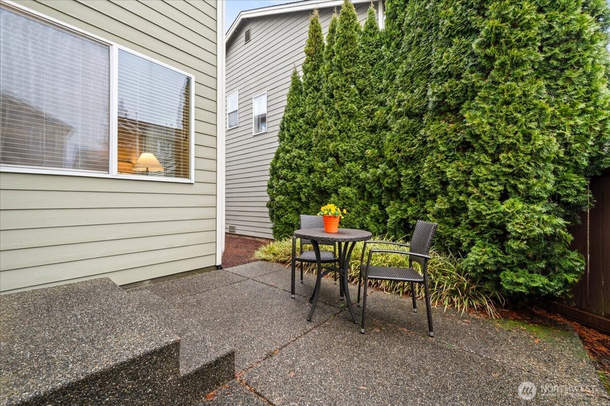 18213 36th Avenue Southeast Bothell, WA 98012 - Photo 31 of 34 a view of a tables and chairs in back of the house