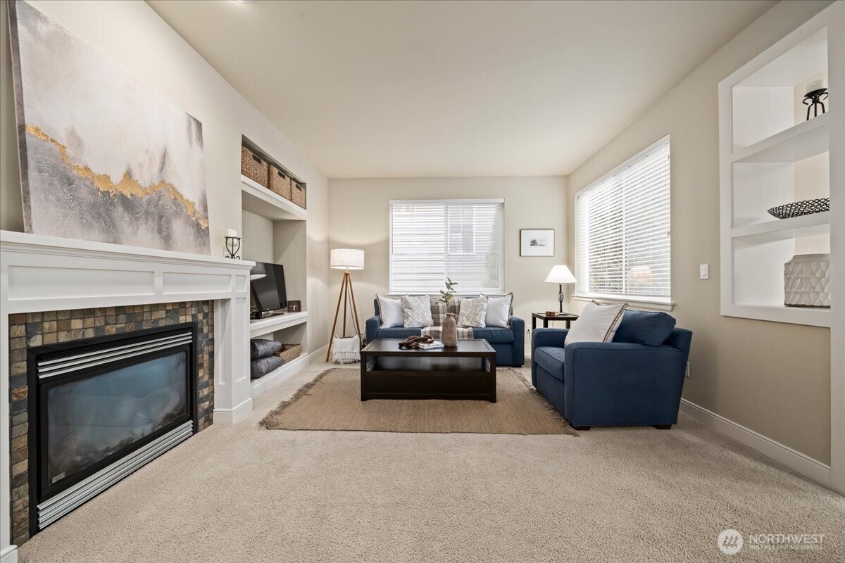 18213 36th Avenue Southeast Bothell, WA 98012 - Photo 4 of 34 a living room with furniture and a fireplace