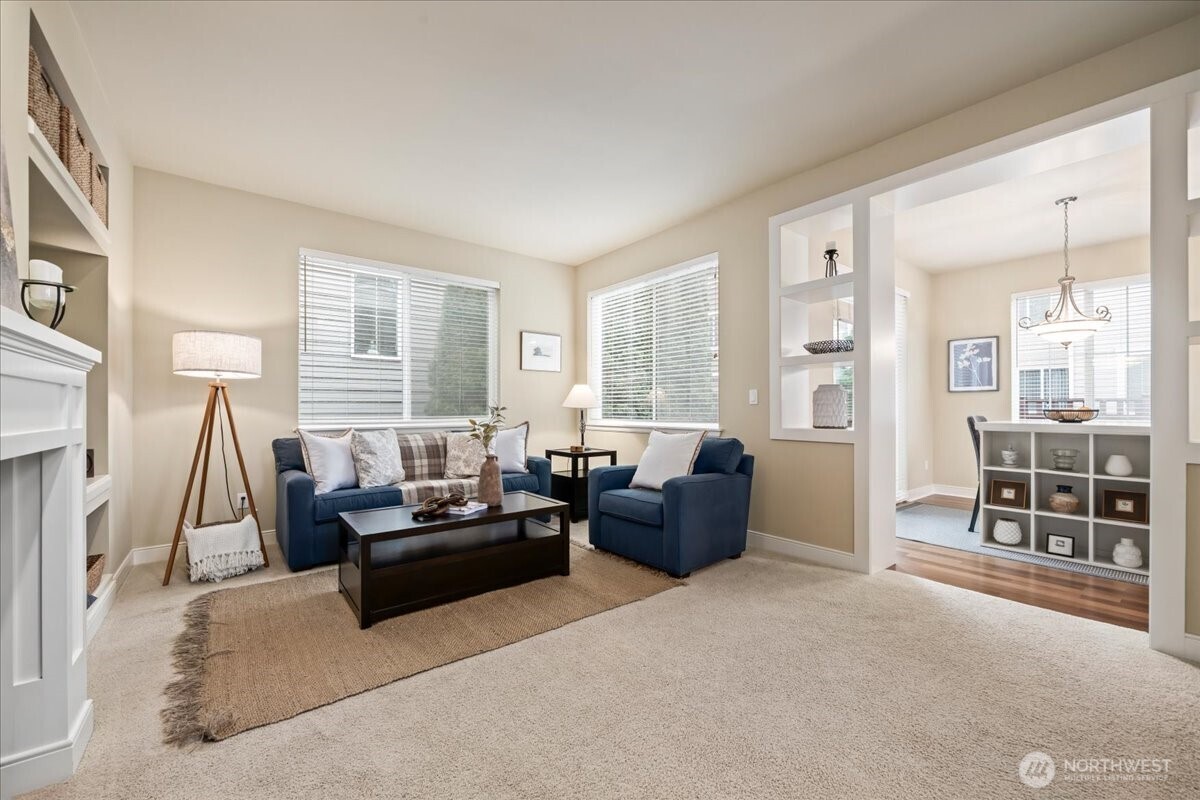 18213 36th Avenue Southeast Bothell, WA 98012 - Photo 5 of 34 a living room with furniture and a large window