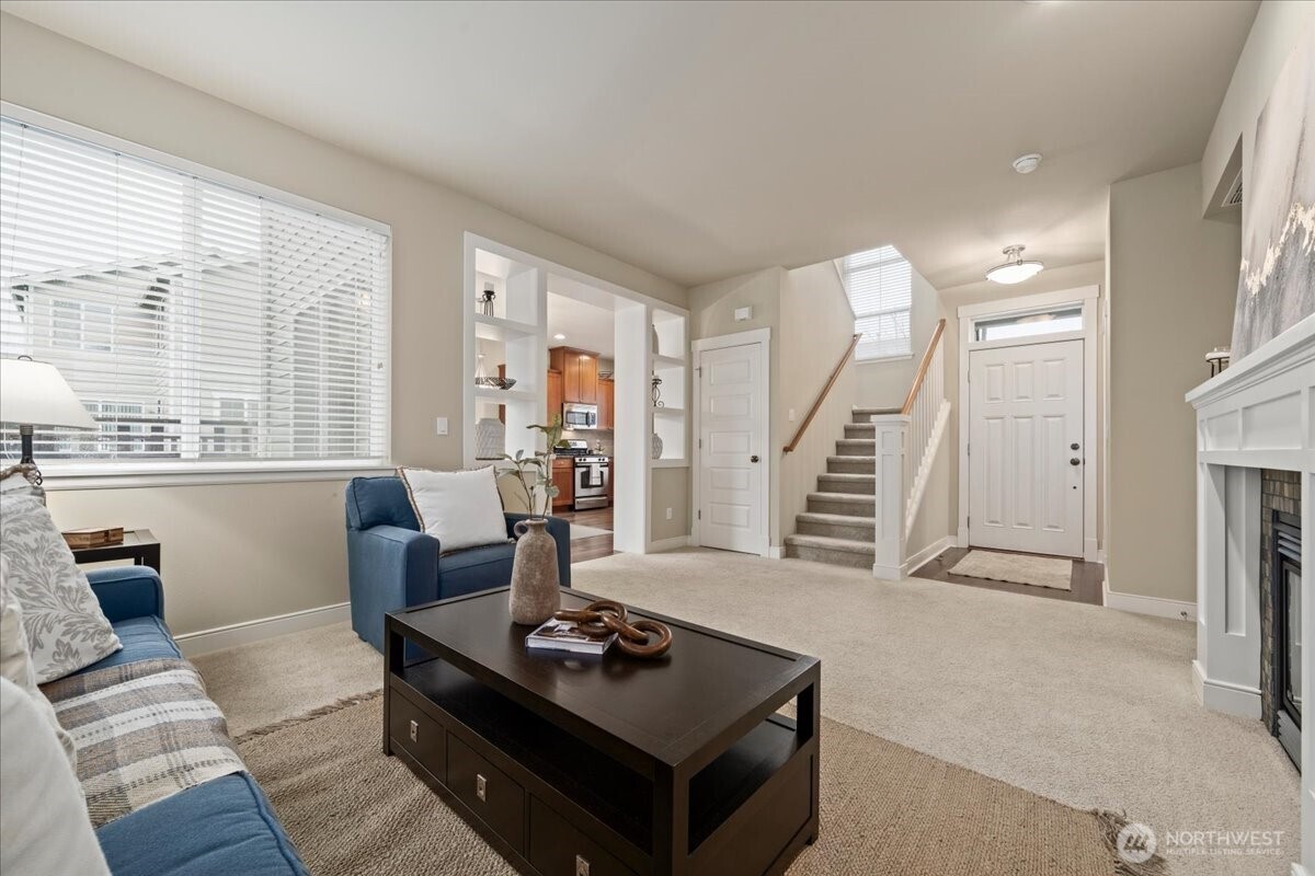 18213 36th Avenue Southeast Bothell, WA 98012 - Photo 6 of 34 a living room with furniture and large windows