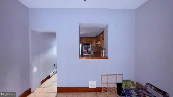 a kitchen with granite countertop a refrigerator and a sink