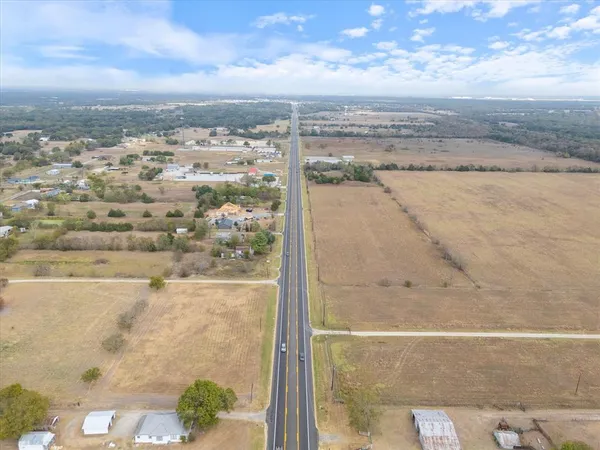 an aerial view of ocean and residential houses