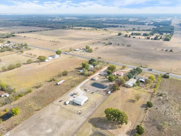 an aerial view of ocean and residential building