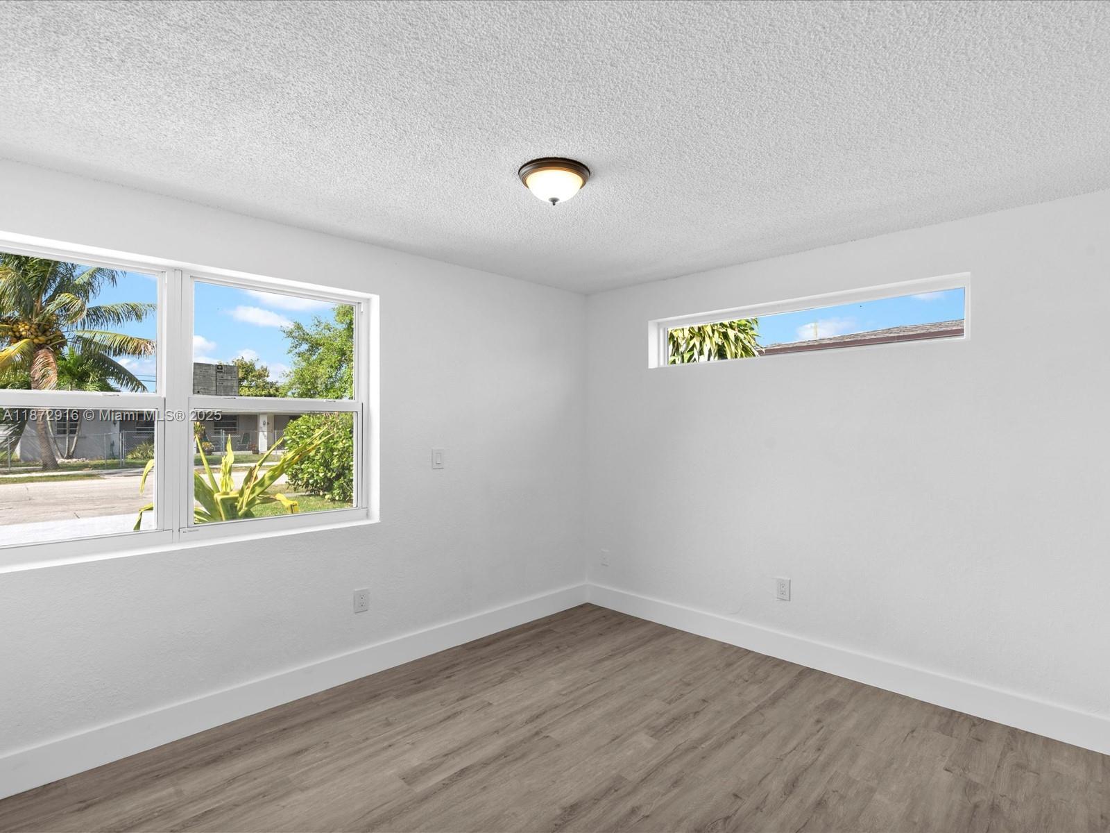 5365 Southwest 97th Court Miami, FL 33165 - Photo 21 of 51 a view of empty room with window