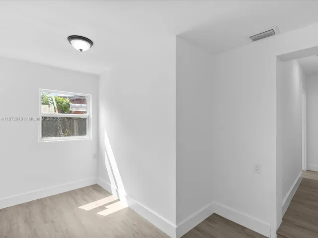 a view of livingroom with hardwood floor and window