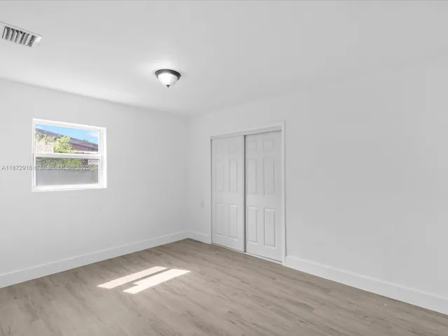 a view of an empty room and window