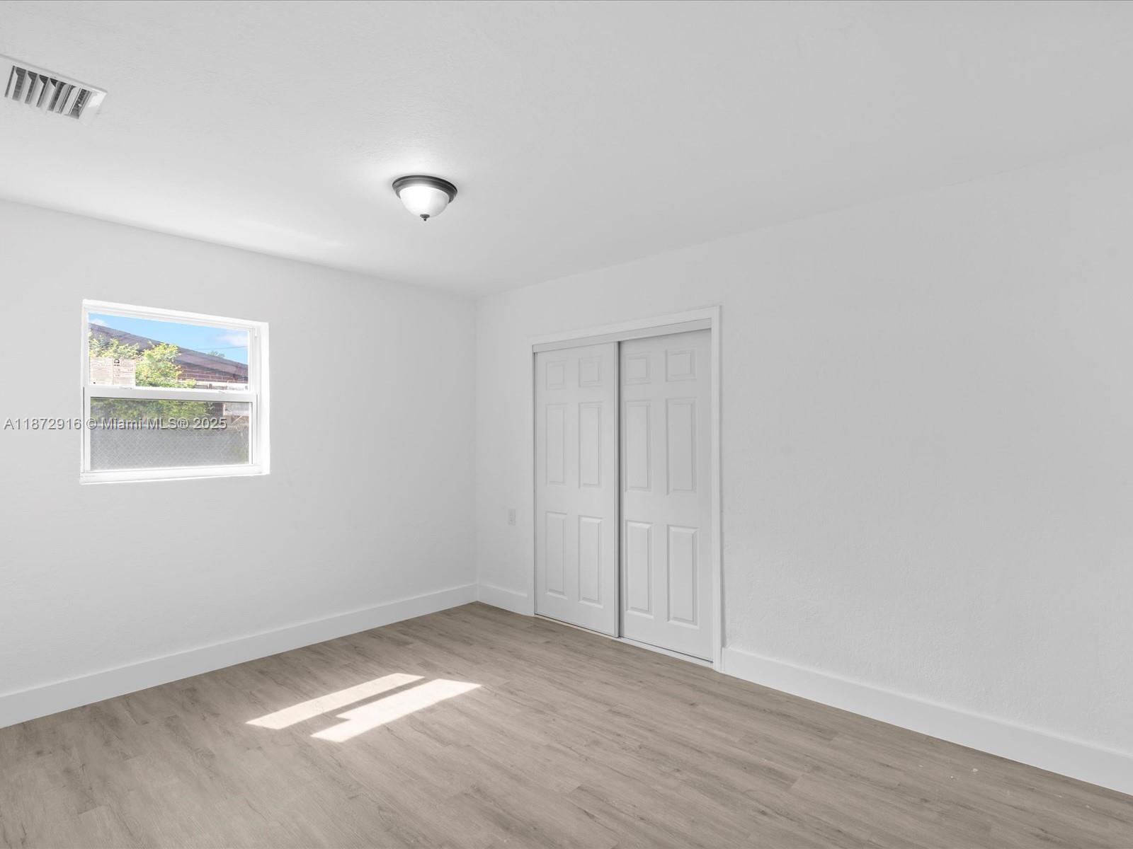 5365 Southwest 97th Court Miami, FL 33165 - Photo 32 of 51 a view of an empty room and window