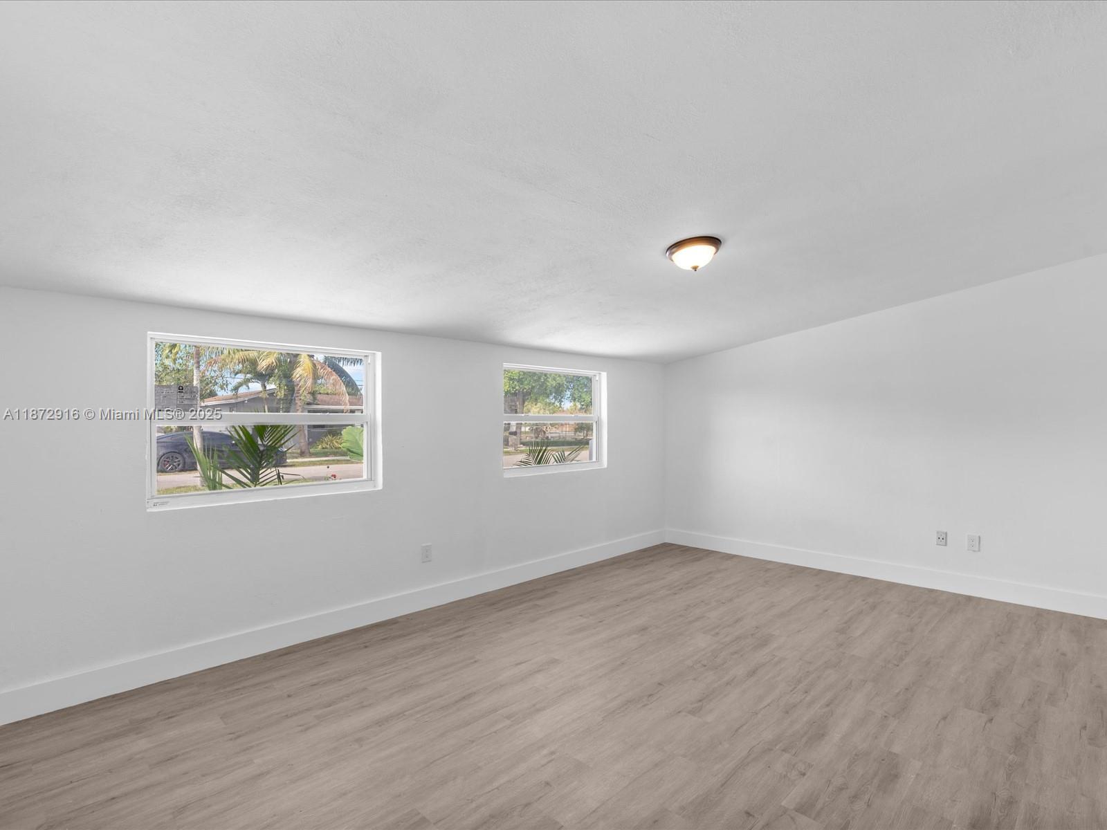 5365 Southwest 97th Court Miami, FL 33165 - Photo 34 of 51 an empty room with windows