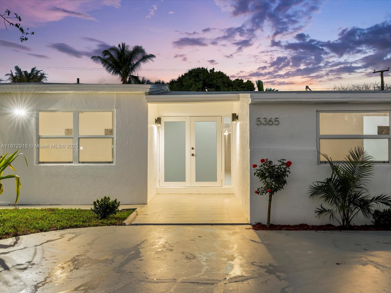 5365 Southwest 97th Court Miami, FL 33165 - Photo 48 of 51 a front view of a house with a yard