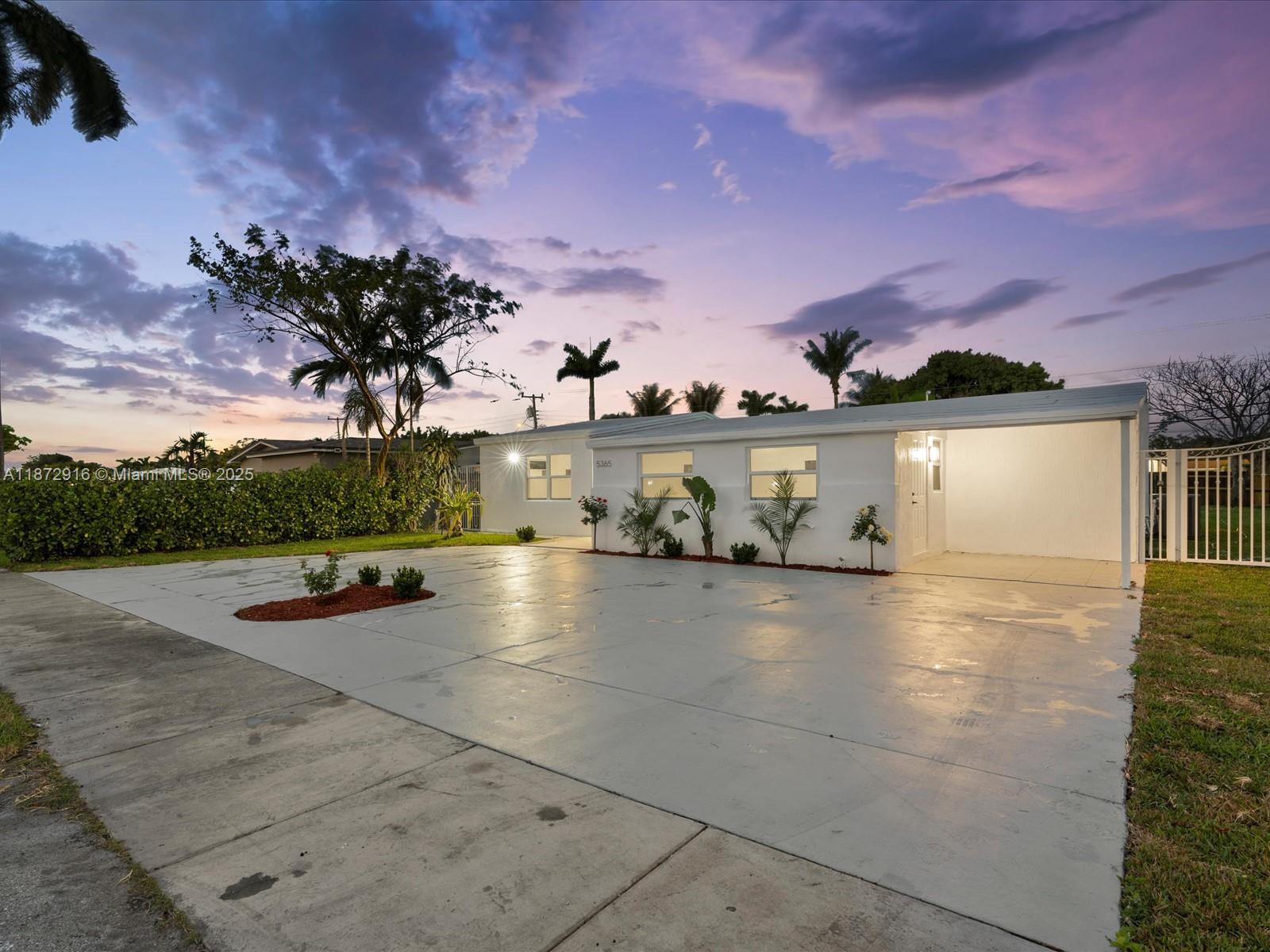 5365 Southwest 97th Court Miami, FL 33165 - Photo 49 of 51 a view of a swimming pool with an outdoor space and seating area