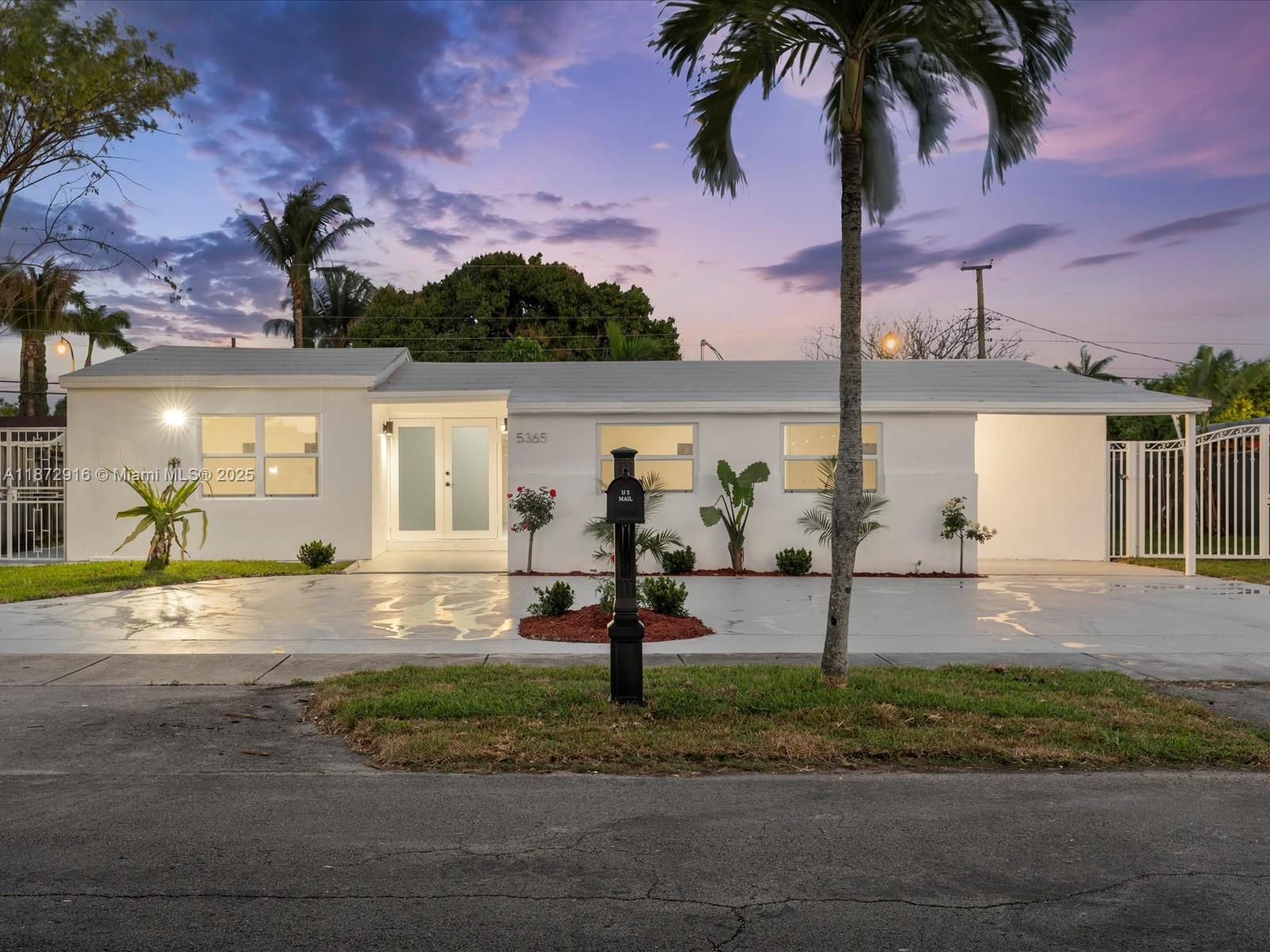 5365 Southwest 97th Court Miami, FL 33165 - Photo 8 of 51 a front view of a house with garden and plants