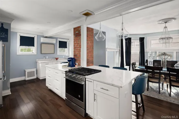 a kitchen that has a stove and a table