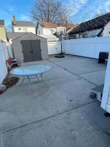 a view of backyard with tub