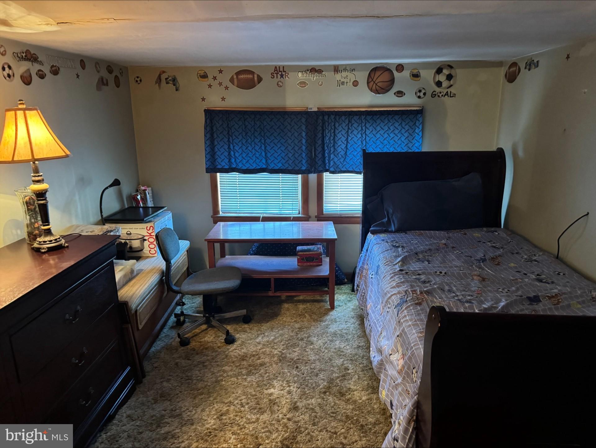 152 Stein Road Ashland, PA 17921 - Photo 21 of 40 a bedroom with a bed and a flat tv screen on the dresser