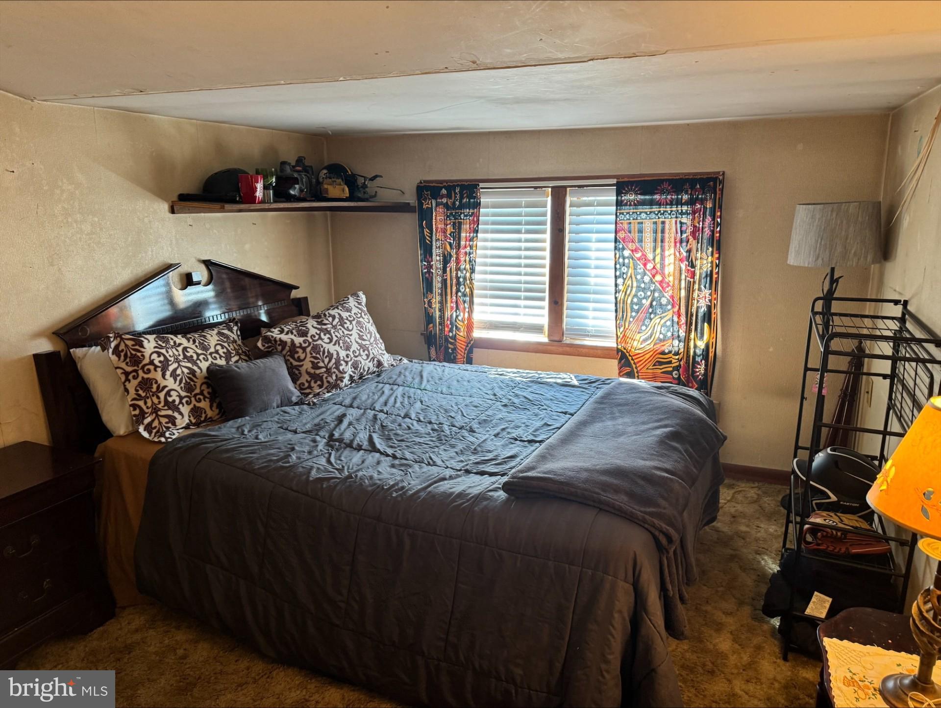 152 Stein Road Ashland, PA 17921 - Photo 22 of 40 a bedroom with bed and a night stand