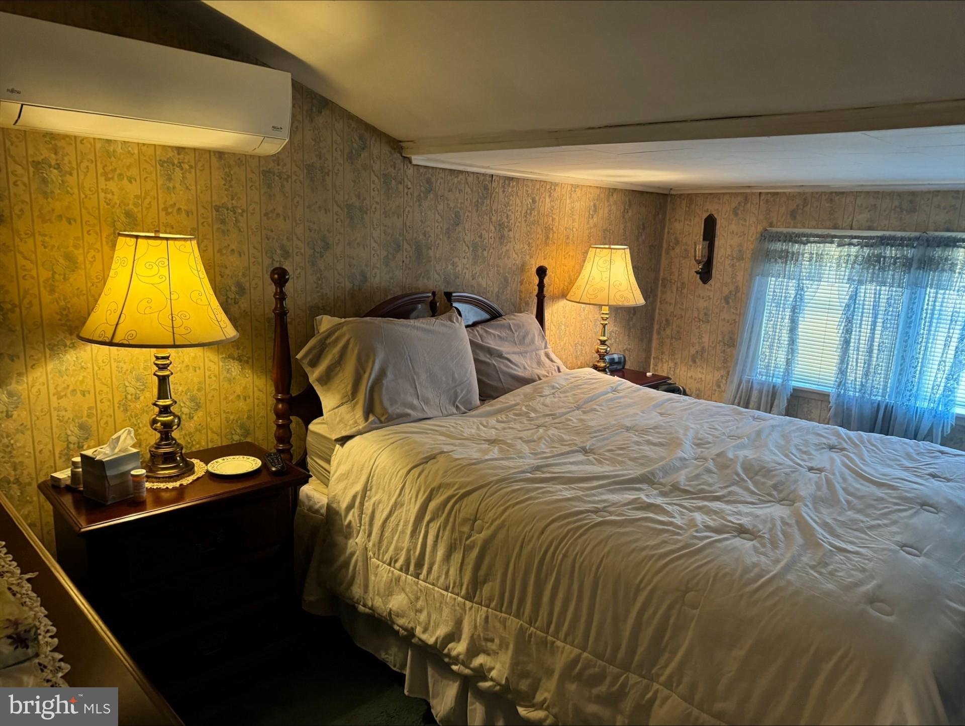 152 Stein Road Ashland, PA 17921 - Photo 23 of 40 a bedroom with a bed and a lamp