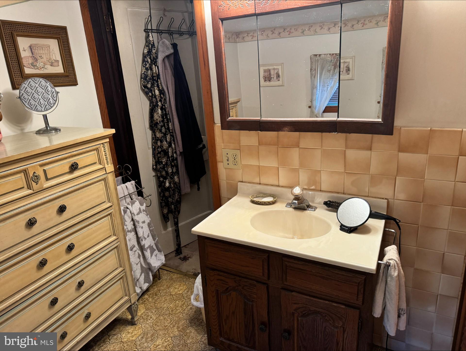 152 Stein Road Ashland, PA 17921 - Photo 25 of 40 a bathroom with a sink a mirror and vanity
