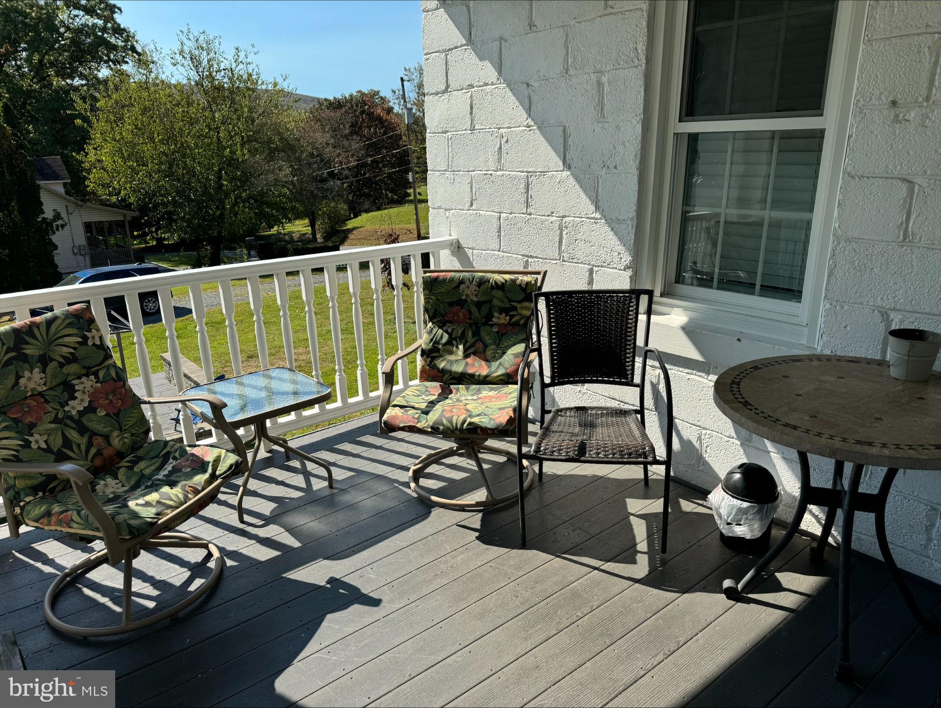 152 Stein Road Ashland, PA 17921 - Photo 27 of 40 a view of a balcony with chairs and a potted plant
