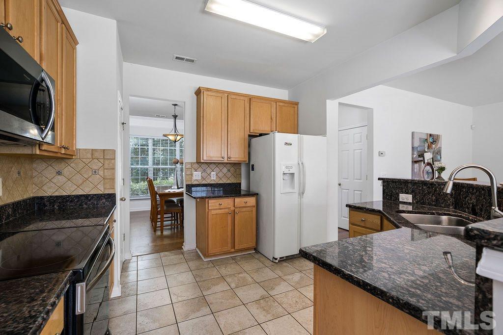 109 Huntersville Road Morrisville, NC 27560 - Photo 15 of 30 Kitchen with Stainless Steel Appliances