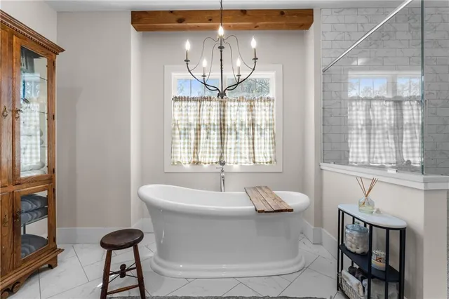 a bedroom with furniture and a window