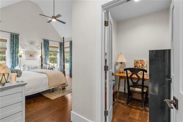 a bedroom with furniture and wooden floor