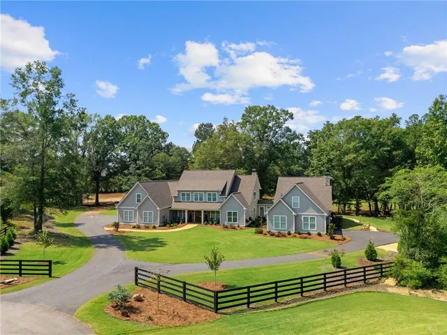 a front view of a house with a yard and porch